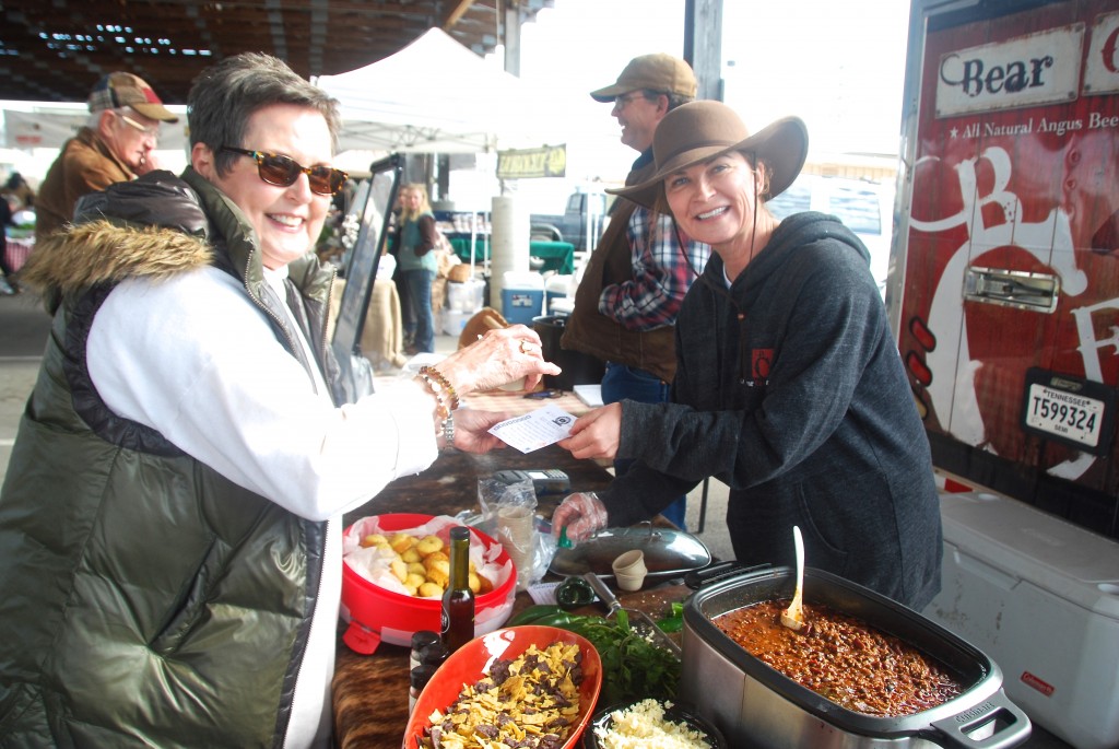 Happy customer tasting local chili from LeeAnn Cherry of Bear Creek Farm