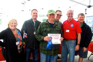 1st Place Best Tasting Strawberry winner Hank Delvin, Sr. with judges