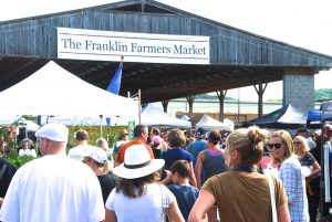 The Franklin community starts their Labor Day weekend shopping for local farm food.